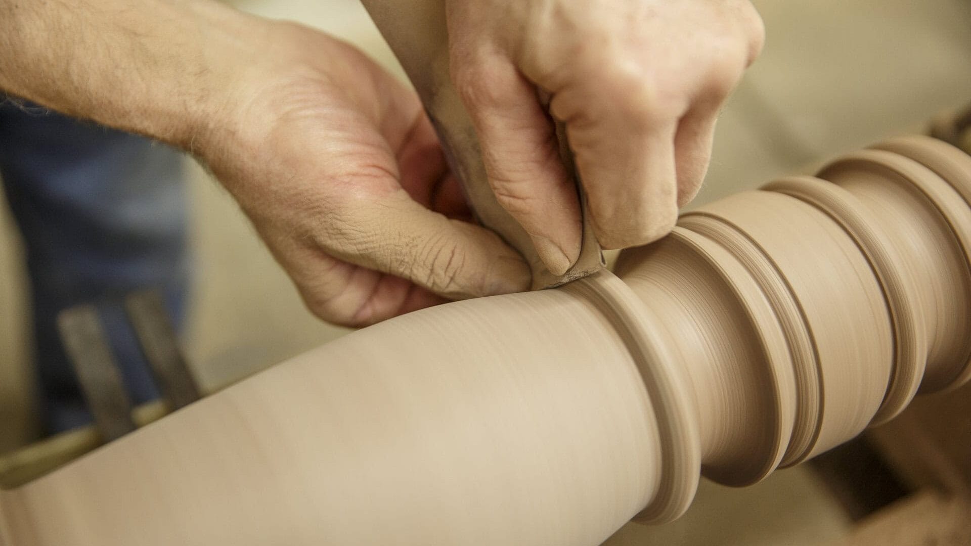 A person is working on a piece of wood